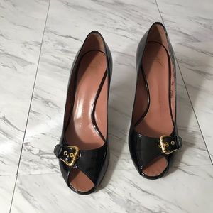 Giuseppe Zanotti black patent peep toe heels.